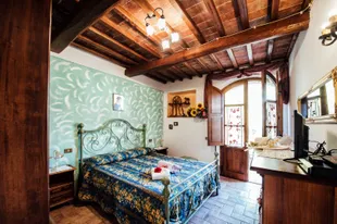 Palazzo-Conti-slaapkamer-houten-balken.jpg