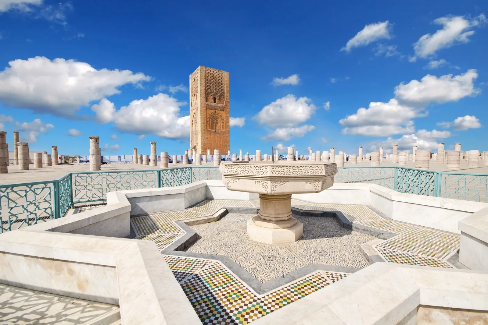 &Olives_Morocco_Tour Hassan tower in the square with stone columns. Made of red sandstone in Rabat
